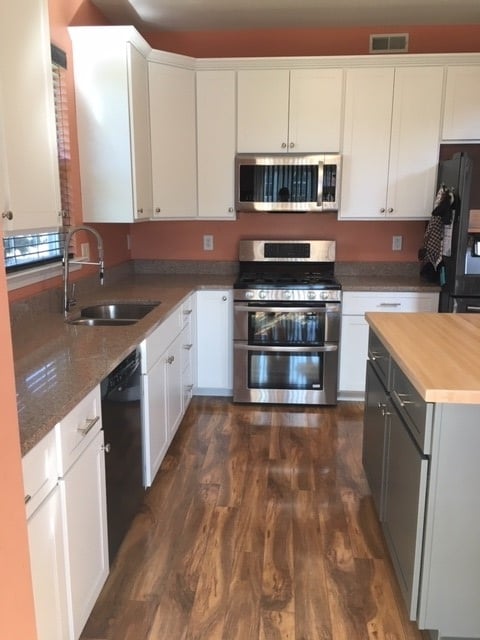 After view of the new white kitchen cabinets
