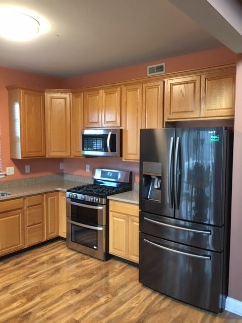 Before view of old brown cabinets