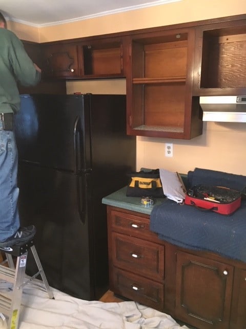 Before view of old brown cabinets