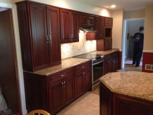 After: New look cabinets with solid cherry wood refacing.